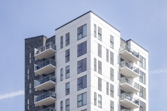 vertical-shot-white-building-clear-sky